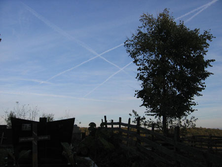 Cemetary with cross in the sky